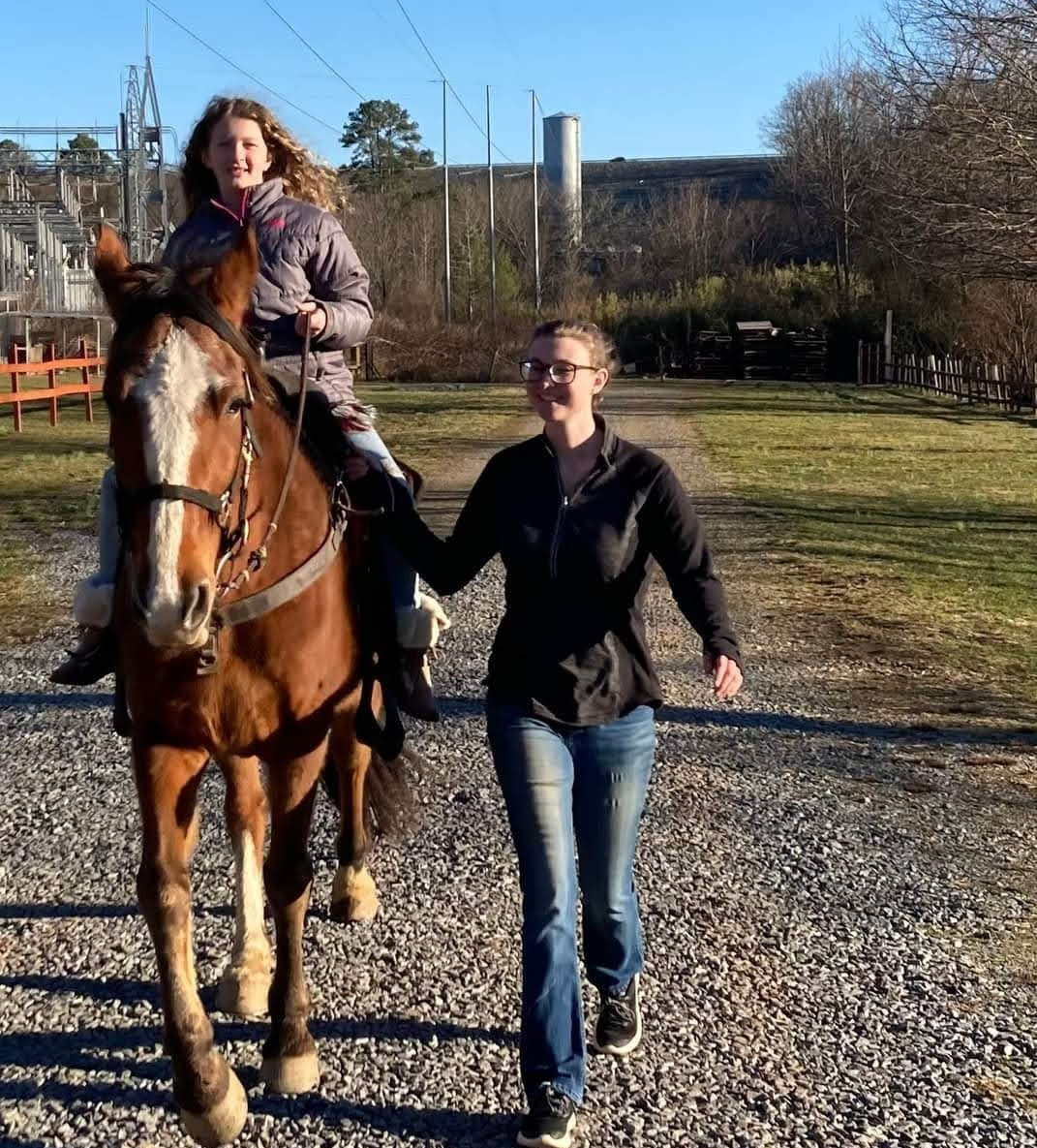 Helping Lilly ride Swagger. :)